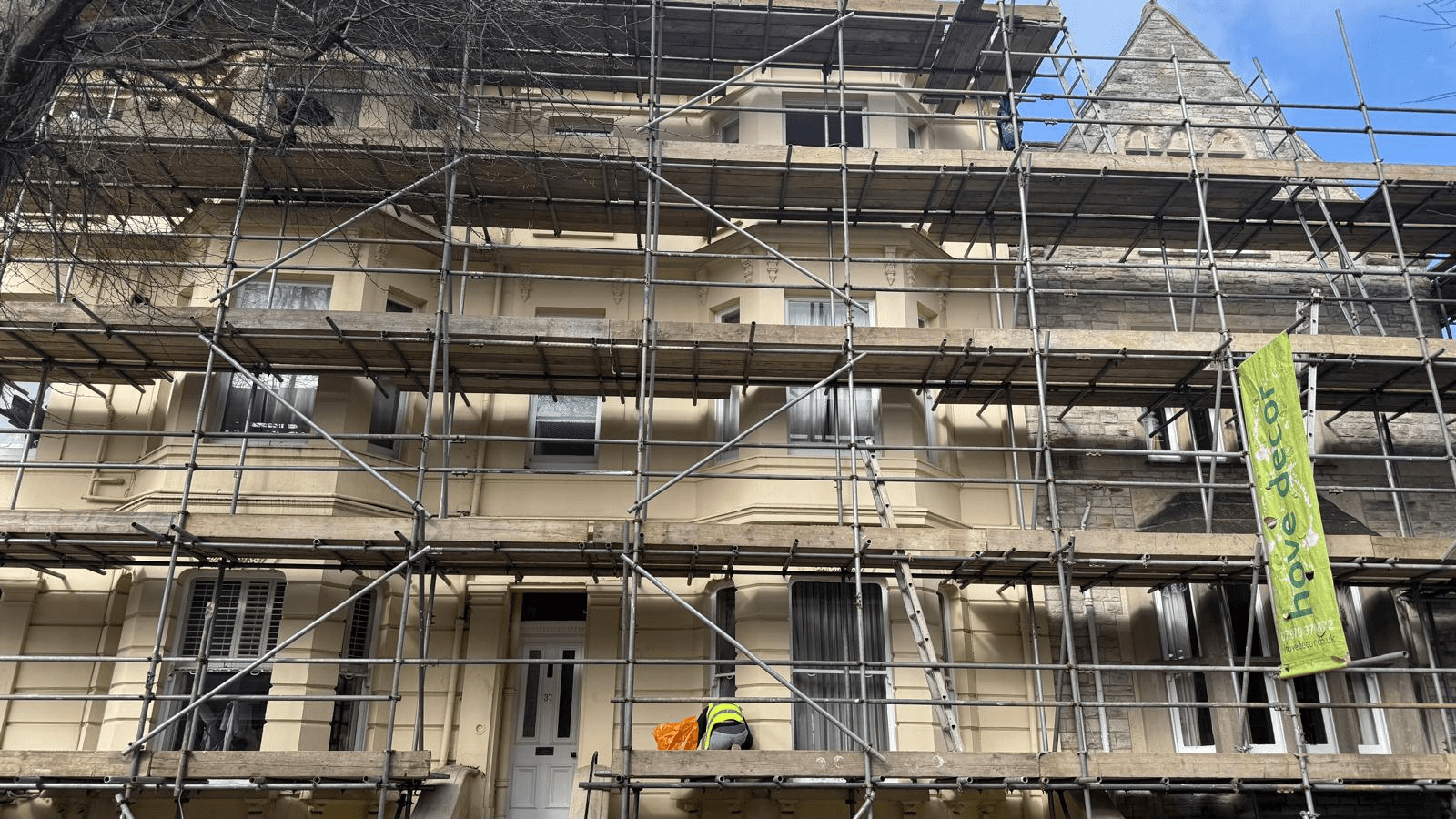 Hove Decor on site, exterior decorating a period block in Brighton & Hove